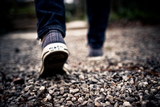 Walking feet gravel path shoes walk legs man